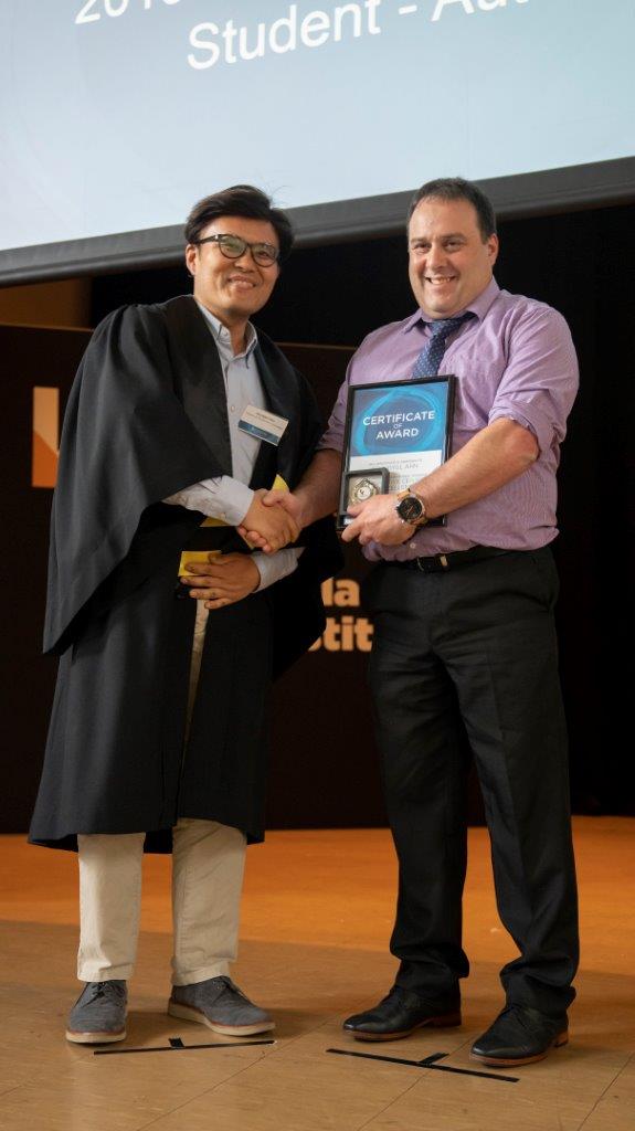 Kangan institute student receiving award during graduation ceremony